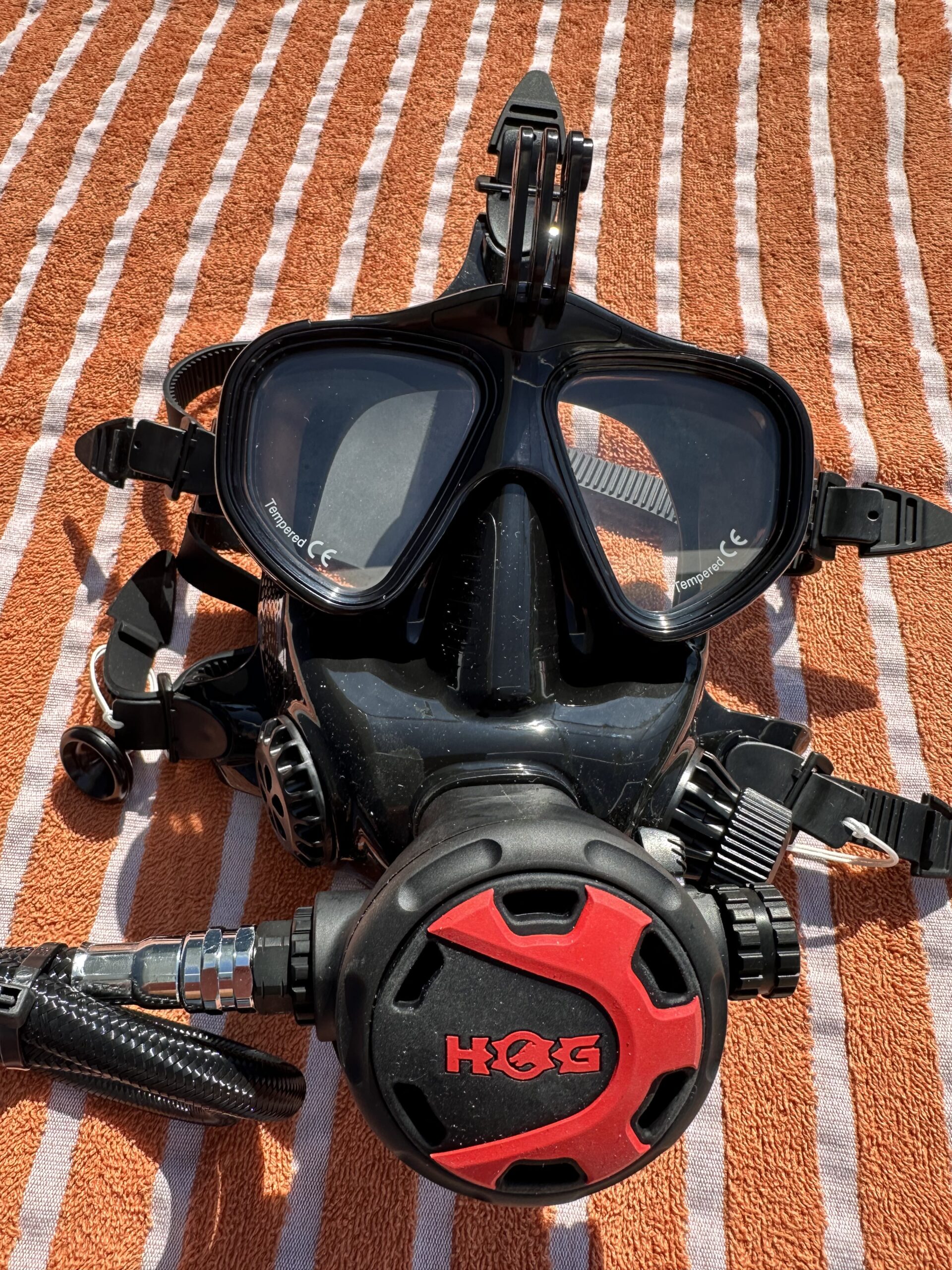 Full face mask placed on a orange towel